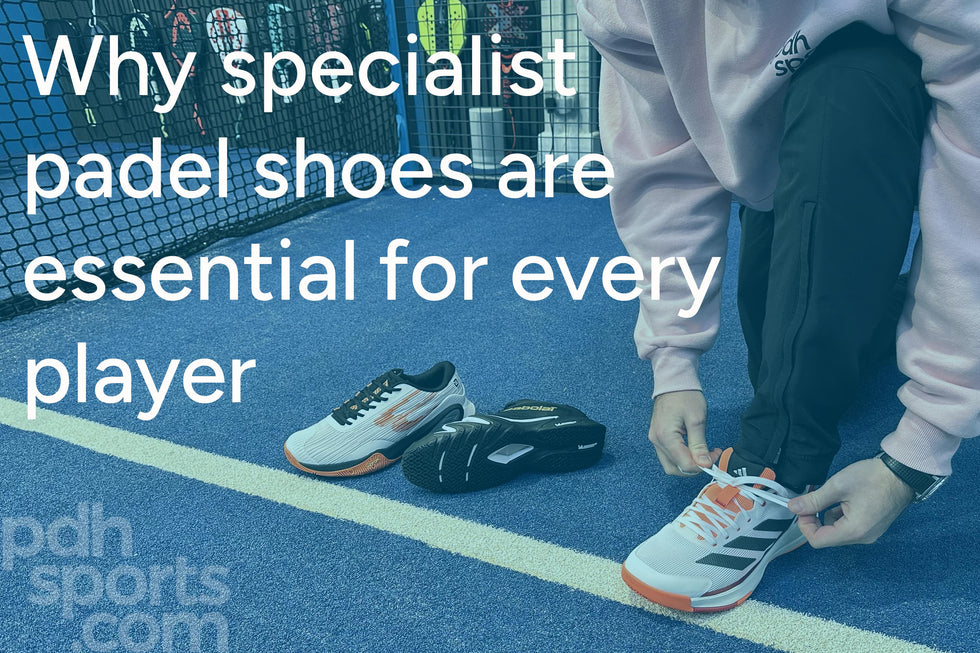 Person tying the laces of a white and orange padel shoe on a blue padel court, with another pair of padel shoes placed beside them.