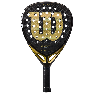 A black and gold Wilson Defy Pro V1 padel racket with a diamond-shaped design and a pattern of holes on the surface.
